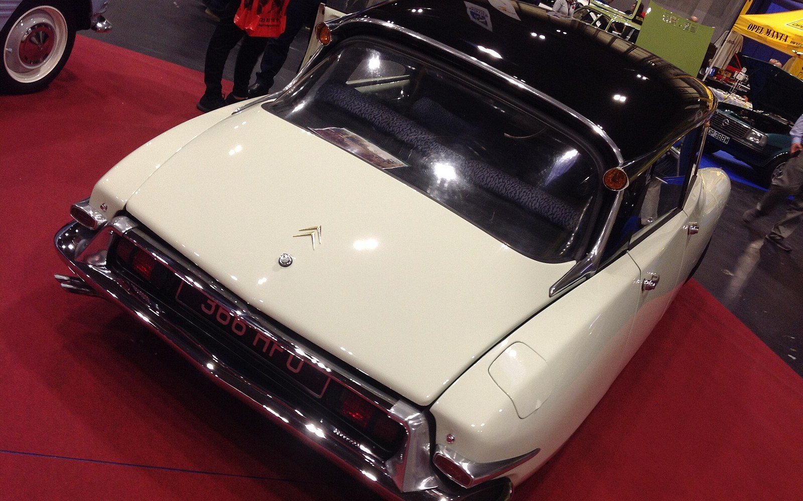 A Citroën DS on a show stand, seen from the rear three-quarter.