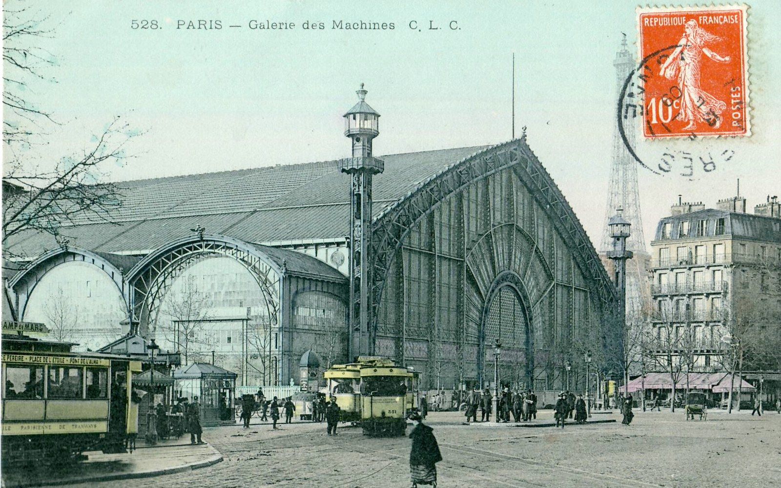 The Galerie des Machines on a period postcard, the Eiffel Tower behind it.