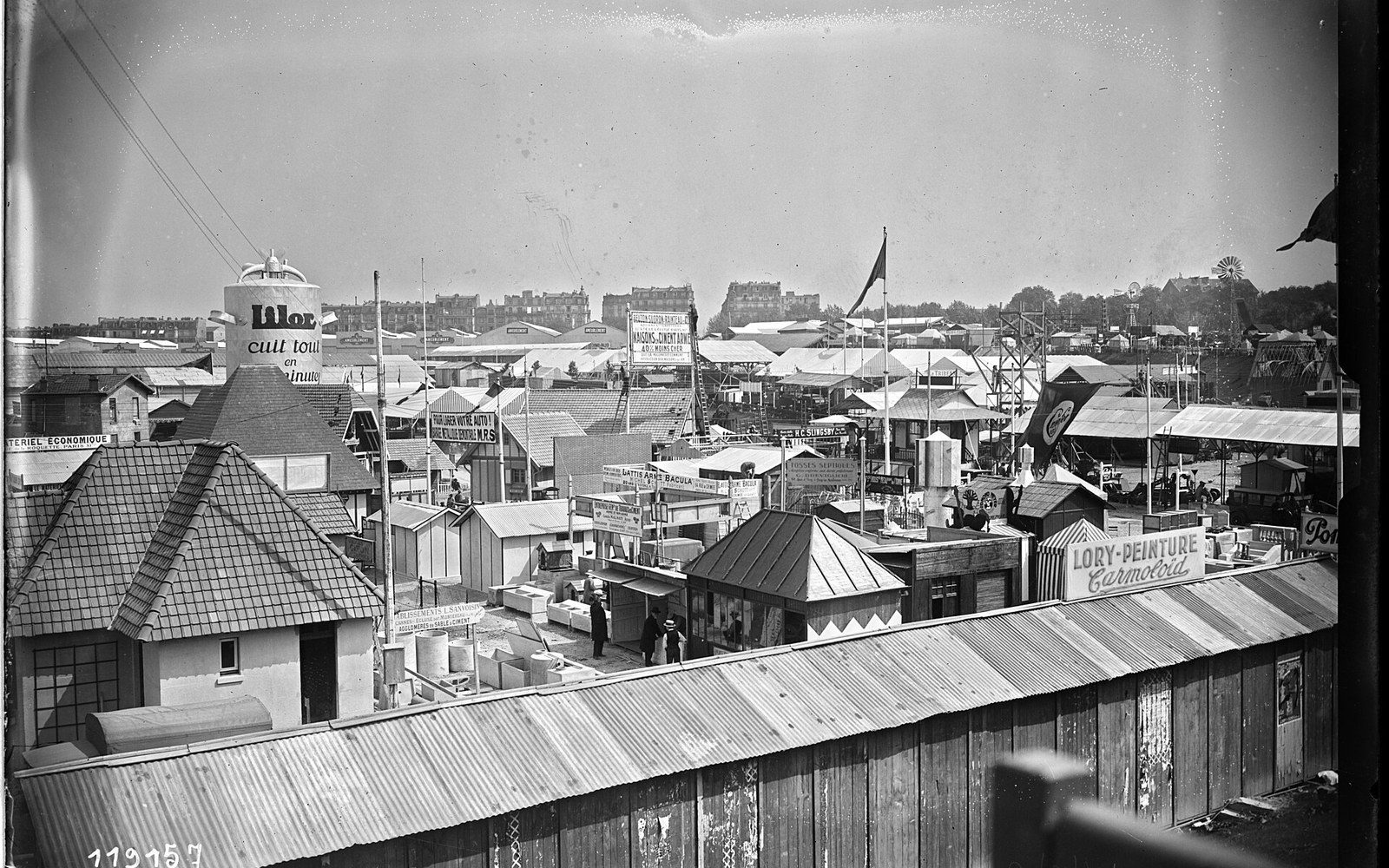 Rooftop view of exhibition pavilions and advertising signs at the Foire de Paris